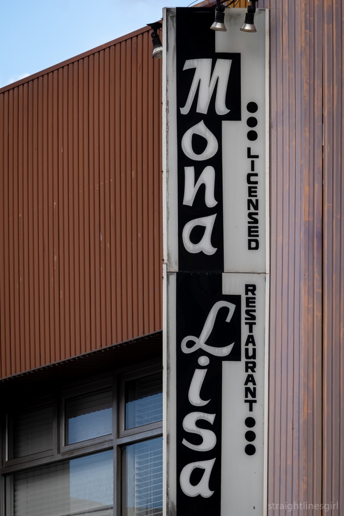 A bkack and whit vertical for the Mona Lisa Loicensed Restaurant