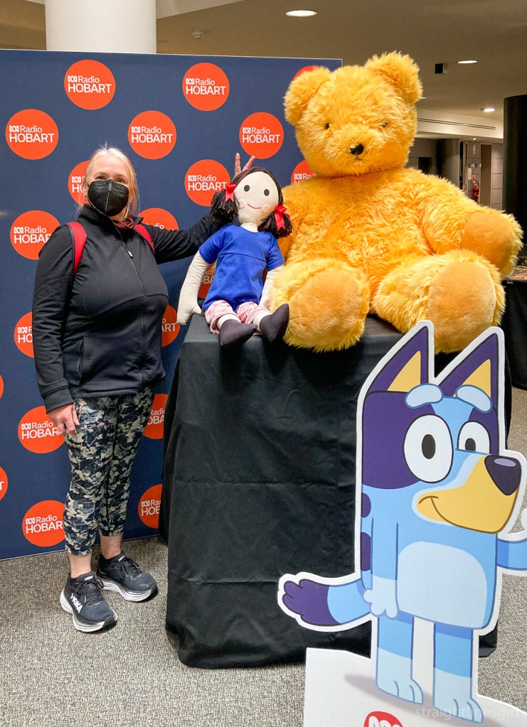 Barb is standing in front of the ABC Radio sign next to Jemima and Big TEd from PLay Schoool. 
