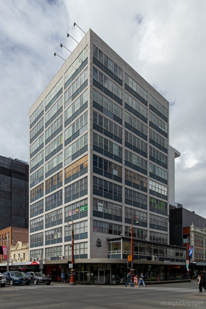 A ten-story class curtain wall building situated on a street corner