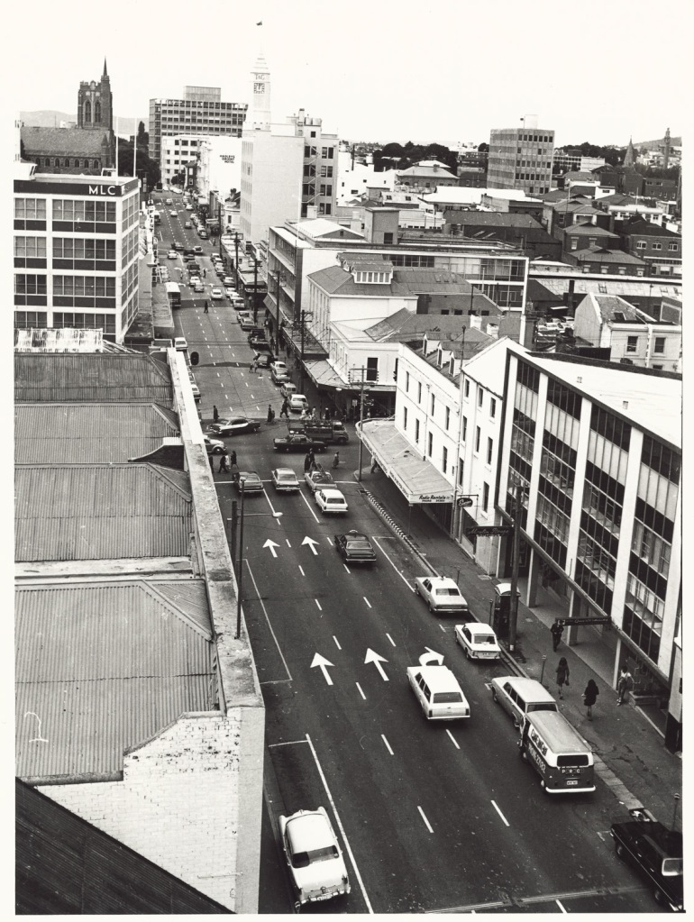 A black and white image looking down on a stret